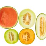 20406005 – various type of melons cut in half over white background