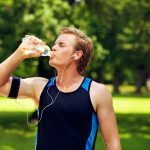 15424011 – thirsty athlete drinking water after workout